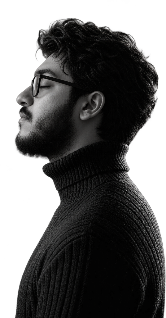 Zakaria Kahlaoui in profile, wearing glasses and a black turtleneck.